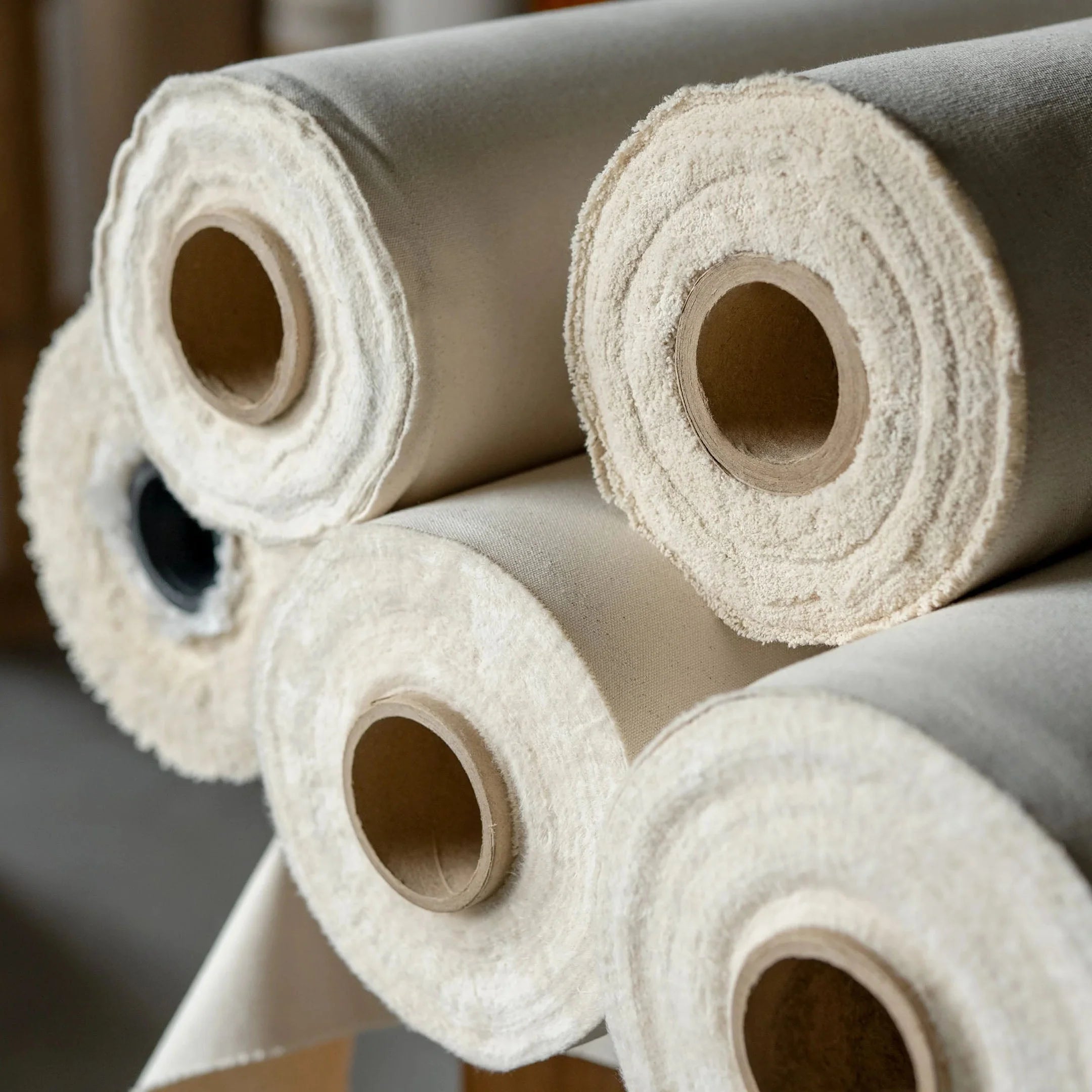 Rolls of gesso-primed canvas